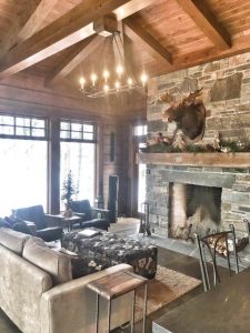 C4 Construction: Custom Cottage, cozy stone fireplace sitting area