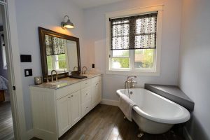 C4 Construction: custom home bathroom vanity and clawfoot tub